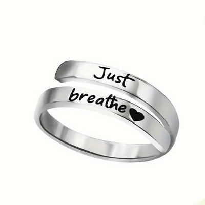 Silver spiral heart ring engraved with Just Breathe